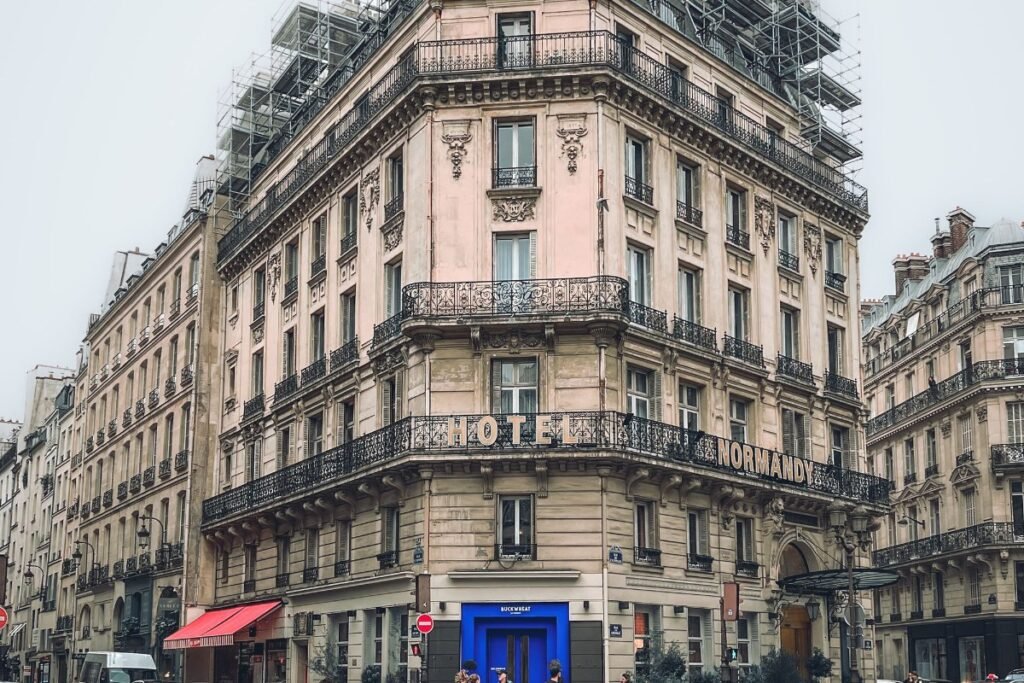 Removal van route through a Paris street with Haussmann buildings